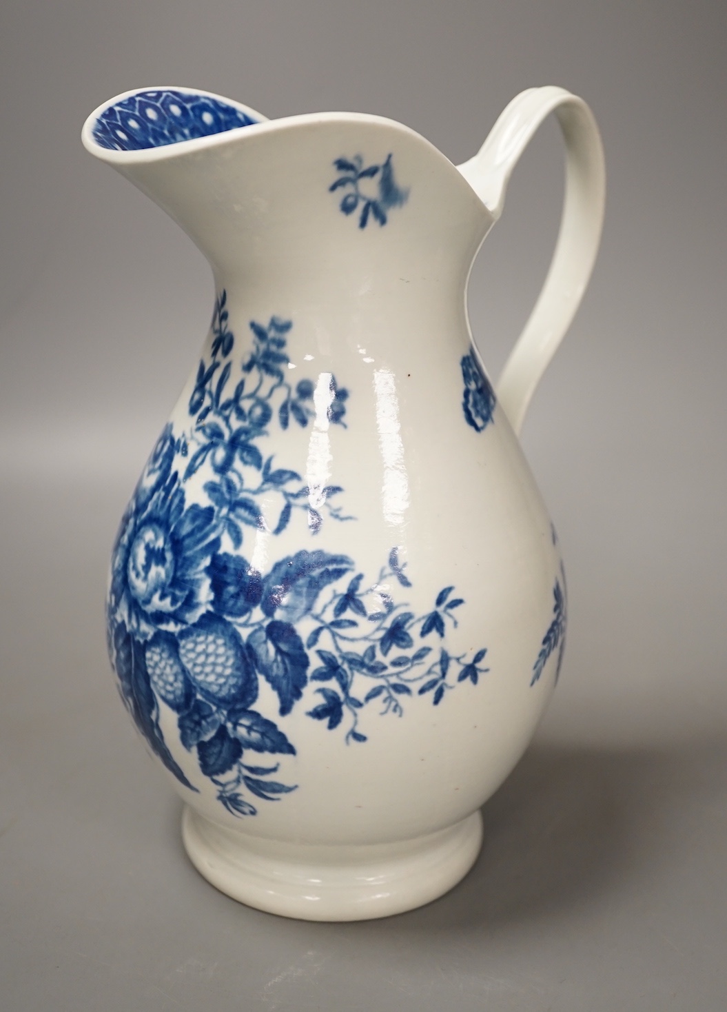 A Worcester French style water ewer decorated in under-glaze blue with fir cones and rose hips c. 1775, 21cm